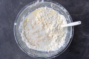 Liquids added to flour mixture.