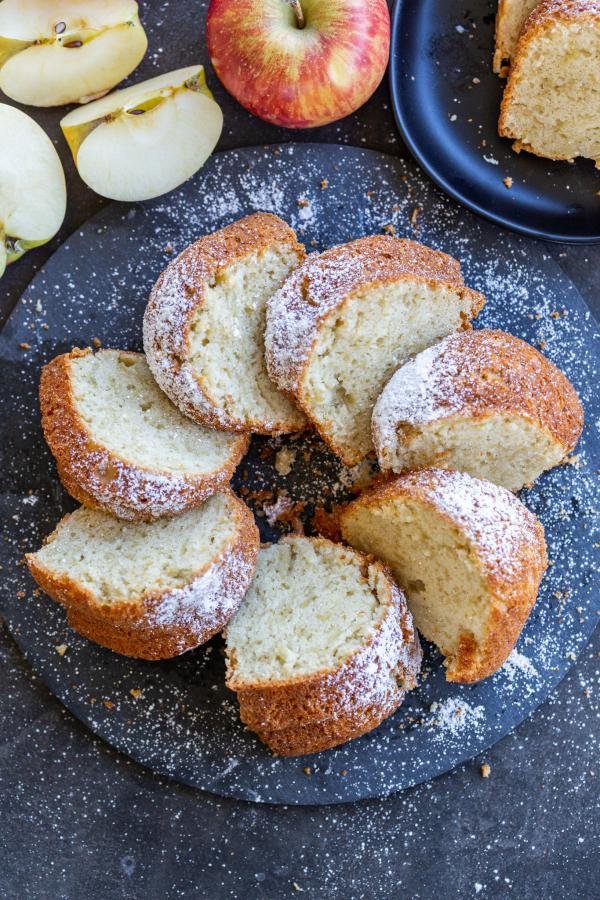 Pieces of sliced apple cake on a tray.