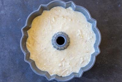 Apple cake batter in a cake pan.