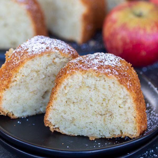 A slice of apple cake slice on a plate.