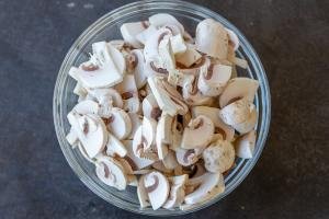 Sliced mushrooms in a bowl.