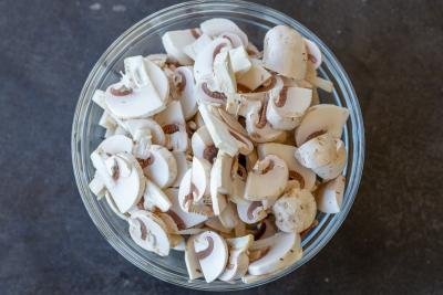 Sliced mushrooms in a bowl.