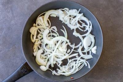 Onions cooking on a pan.