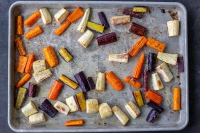 Roasted Roasted Carrots And Parsnips on a baking dish.