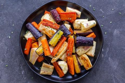 Plate with Roasted Carrots And Parsnips.