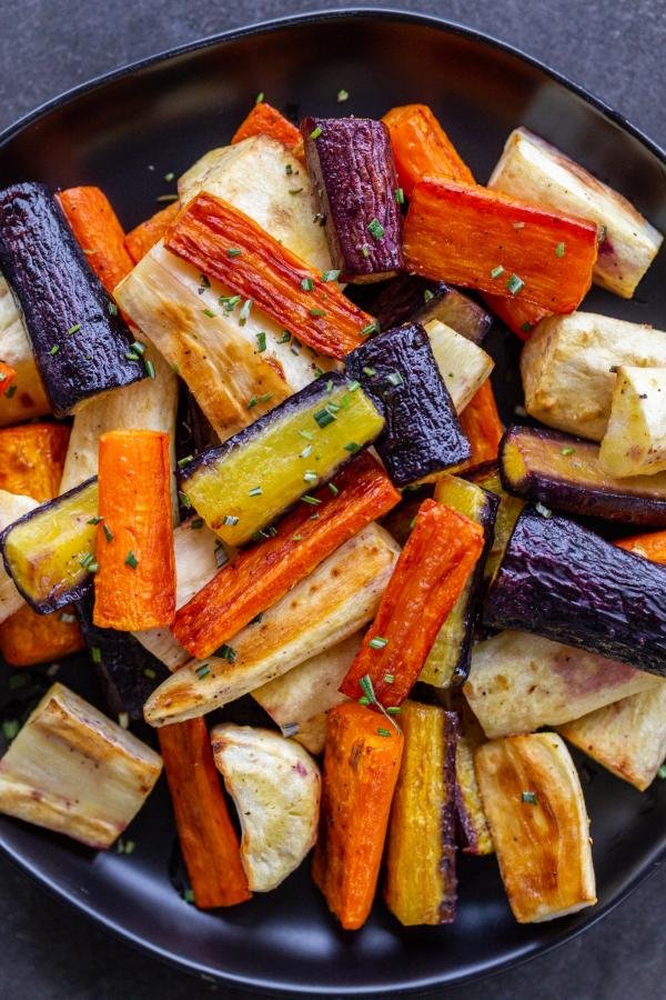 Roasted Carrots And Parsnips on a plate. 