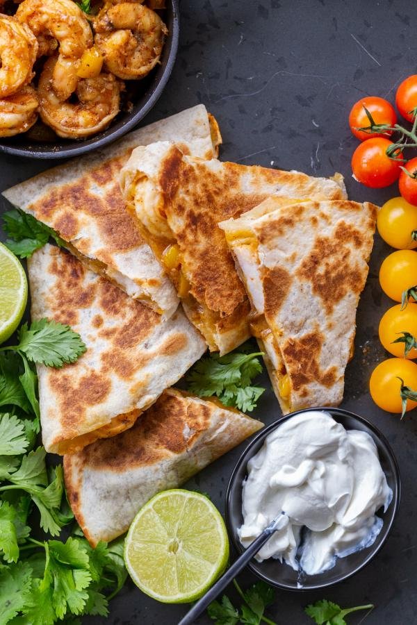 Shrimp Quesadillas with sour cream and other veggies. 