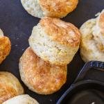 Sourdough Biscuits with a pan next to them.