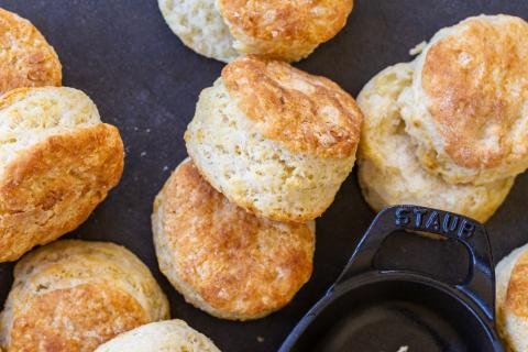 Sourdough Biscuits with a pan next to them.