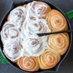 Cinnamon rolls with a cream cheese topping.