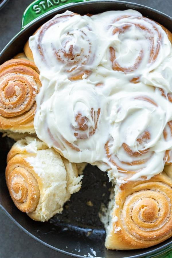 Cinnamon rolls topped with cream cheese frosting.