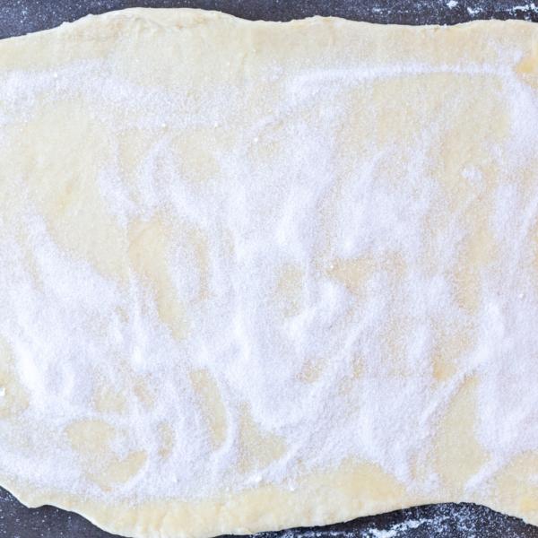 Sugar applied to the cinnamon rolls dough.