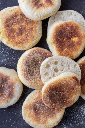 Cooked English Muffins cut open.