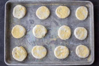 Cut out English Muffins on a baking sheet.