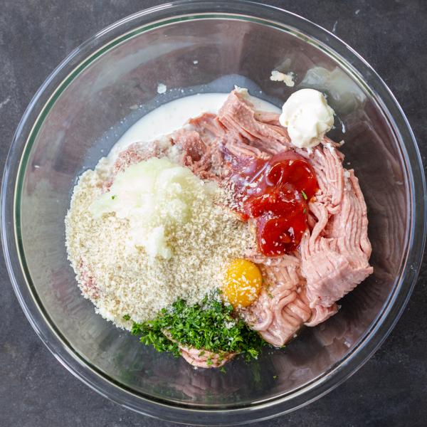 All the turkey meatloaf ingredients in a bowl.