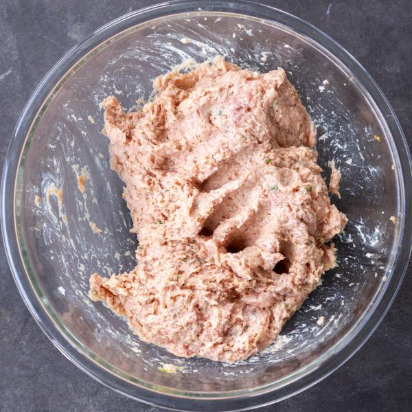 Combined meatloaf ingredients in a bowl.