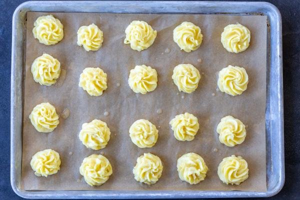 Lined baking sheet on a baking tray.