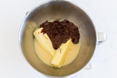 Chocolate butter and condensed milk in a mixing bowl.