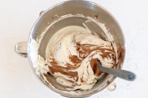 Chocolate mixture added to heavy whipping cream.
