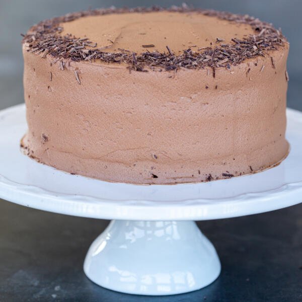 Boozy Chocolate Liqueur cake on a cake stand.