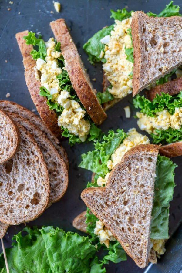Cut in pieces egg salad sandwiches.