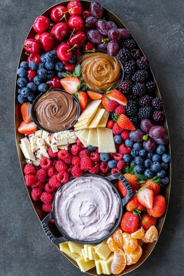 Fruit Charcuterie Board with dipping sauce and fruits. 