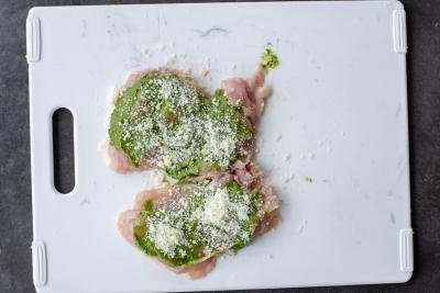 Chicken with pesto and parmesan cheese.