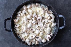 Mushrooms added to the pan with parmesan.