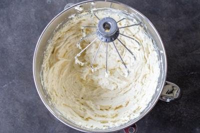 White chocolate cream whisked in a bowl.