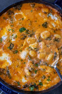 Creamy Cheesy Baked Gnocchi with a spoon.