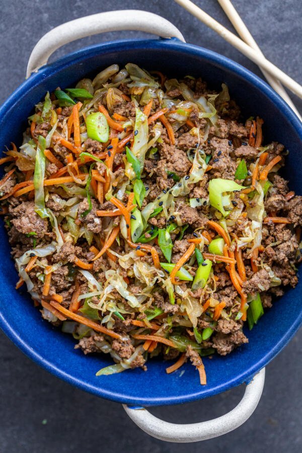 Egg Roll in a Bowl with chopsticks on the side. 