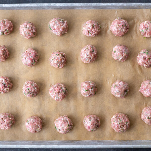 Shaped Lamb Meatballs on a baking sheet.