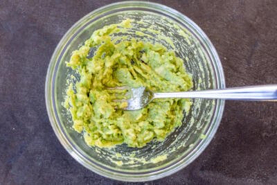 Mashed avocado in a bowl.