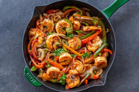 Cooked Shrimp Fajitas in a pan.