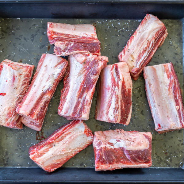 Beef short ribs on a tray.
