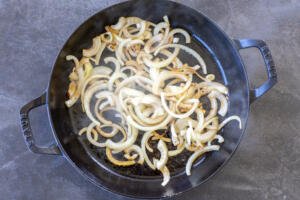 Sautéed onions in a pan.