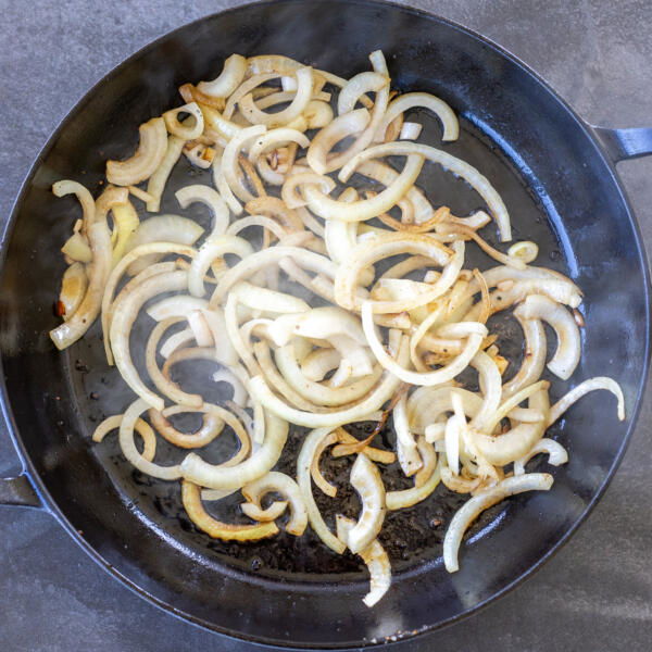 Sautéed onions in a pan.