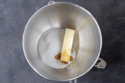 Butter, vanilla and sugar in a mixing bowl.