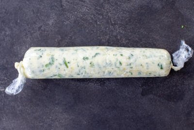 Herb butter shaped into a tube.