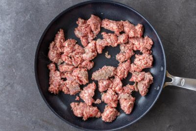 Breakfast sausage in a pan.