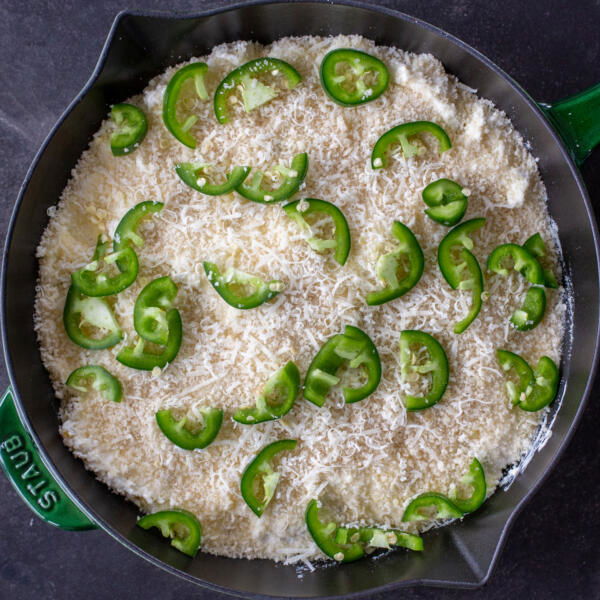 Jalapeno Popper Dip topped with fresh jalapeños.