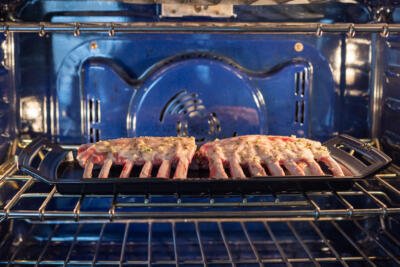 Rack of Lamb roasting in the oven.