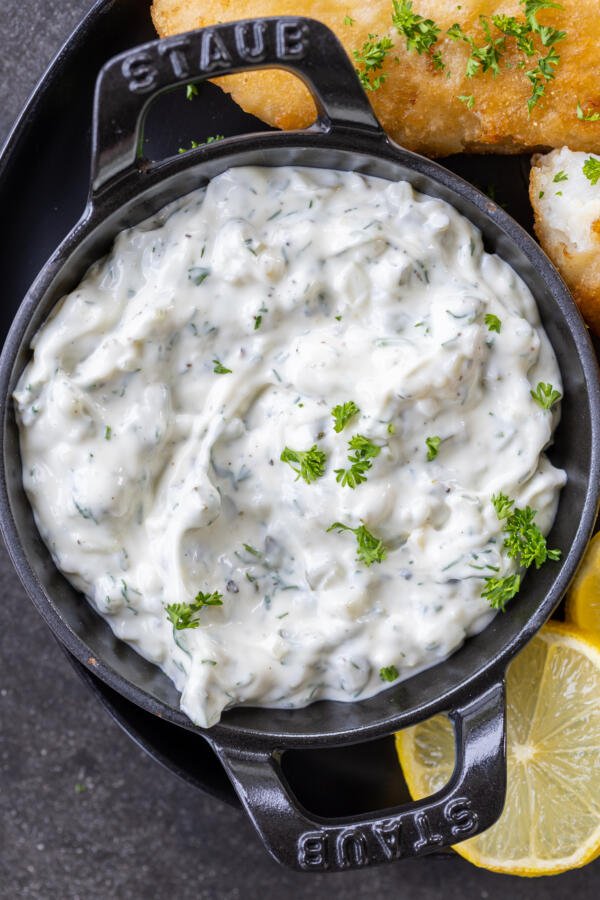 tartar sauce with topped with hers in a serving dish. 