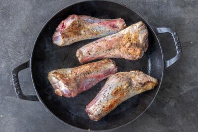 Browned shanks on a pan.