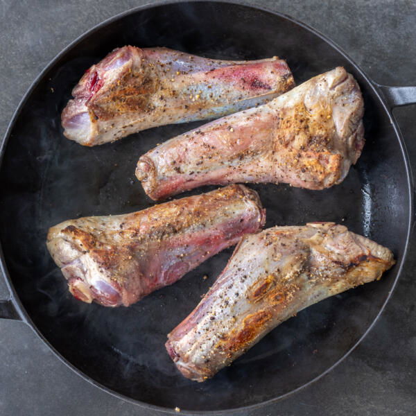 Browned shanks on a pan.