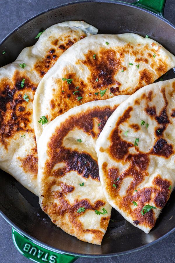 Imeruli Khachapuri with herbs on top.