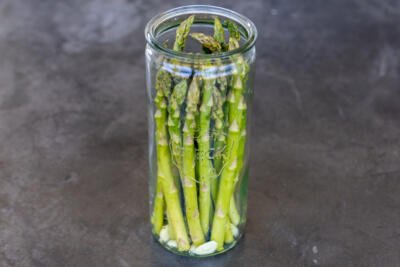 Asparagus with garlic in a jar.