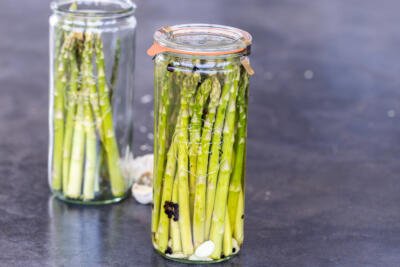Pickled asparagus in a jar.