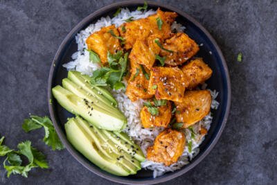 Air Fryer Salmon Bites on a serving plate with rice.