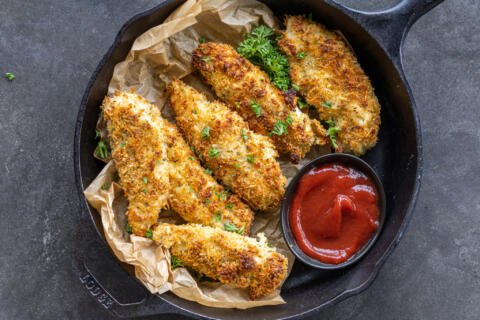 Baked chicken tenders with dipping sauce.